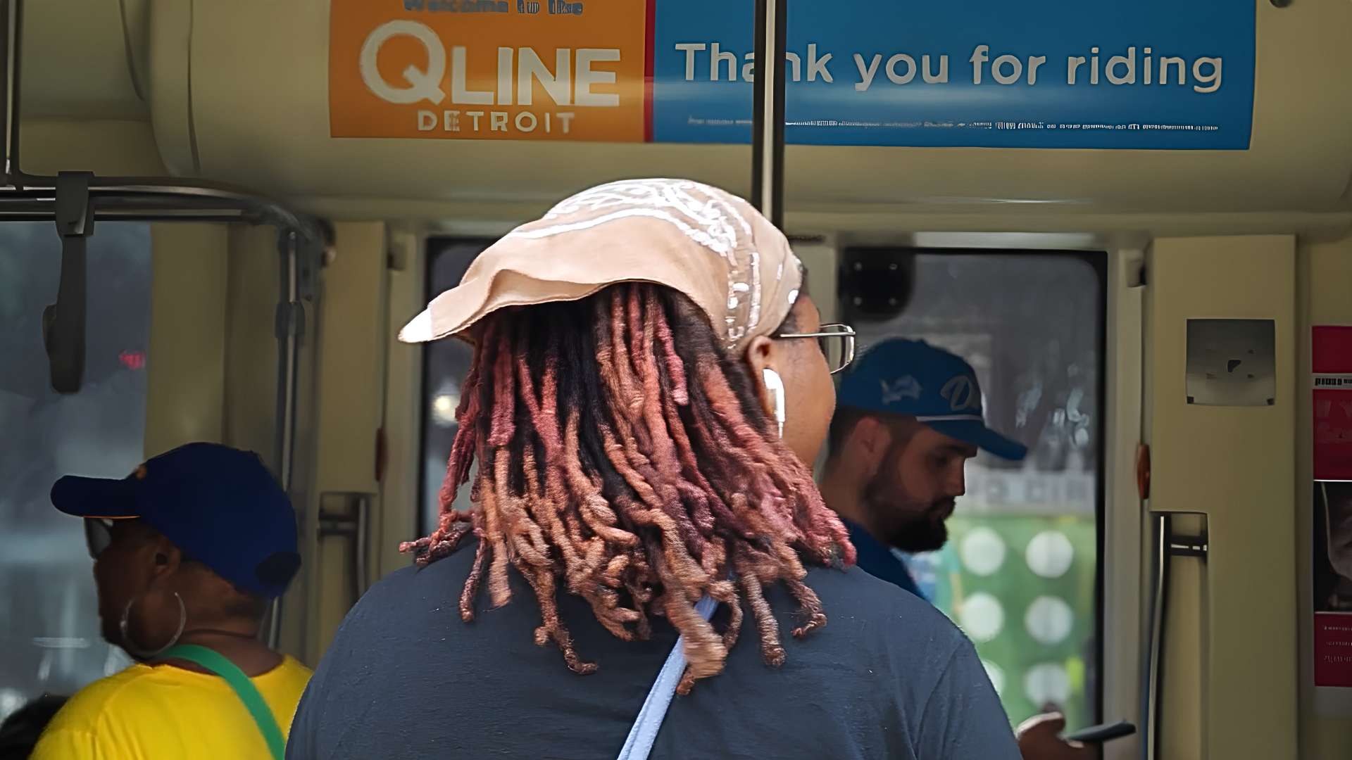A rider boards the QLINE