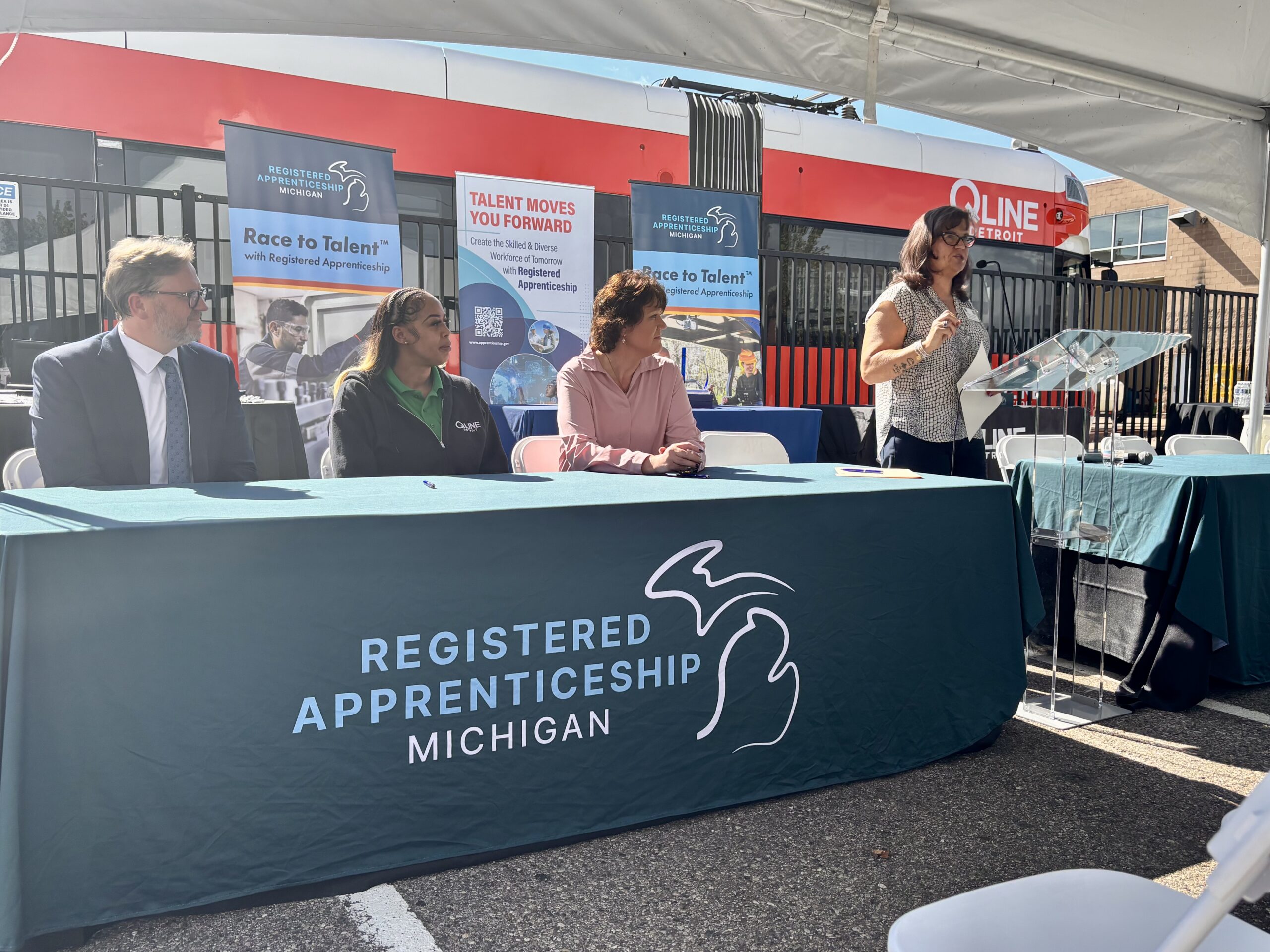 RTA Executive Director Ben Stupka, QLINE Streetcar Operator DeCaria Davis, QLINE General Manager Rachel Schmuhl, and U.S. Department of Labor's Tiffanie Clawson at the QLINE Race to Talent Apprenticeship Program Signing Ceremony.